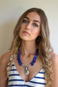 This handmade choker necklace is a beautiful combination of Lapis Lazuli big stones and beautiful Antique Silver plated pendant, that create an exotic color combination. This is a fashionable, one of a kind necklace. It is super cool, with such a great bohemian look. please check my website. See my unique collection: www.ninnos.etsy.com www.ninonarimanidze.com Blue Lapis Lazuli Jewelry For Festivals, Handmade Lapis Lazuli Necklaces, Spiritual Blue Choker Jewelry, Festival Jewelry With Gemstones, Handmade Lapis Lazuli Jewelry For Festivals, Blue Lapis Lazuli Jewelry, Blue Bohemian Choker Jewelry, Bohemian Blue Choker Jewelry, Blue Bohemian Choker