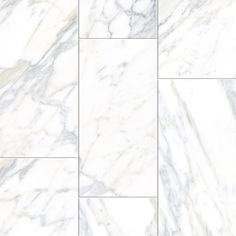 a white marble tile floor with different patterns