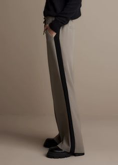 A modern take on the tuxedo pant Tuxedo Style Tailored Pants For Night Out, Full Length Pants With Side Stripes, Wide Leg Bottoms With Contrast Trim For Work, Modern Formal Long Pants, Modern Formal Long Bottoms, Spring Wide Leg Bottoms With Contrast Trim, Office Tuxedo Style Straight Pants, Tuxedo Style Straight Office Pants, Tuxedo Style Straight Pants For Office