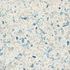 a white tile with blue and gray speckles