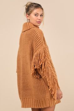 Winter's warmest must-have is hereâ€”the Lulus Coziest Heart Tan Oversized Cable Knit Fringe Sweater Mini Dress! This essential dress is composed of ultra-chunky knit that shapes a ribbed knit turtleneck and a relaxed-fit bodice with cabled details throughout. Boho-chic fringe trim runs across the dropped shoulders and down the outside edges of the long sleeves, ending at ribbed cuffs. Ribbed knit mini hem completes the look. Fit: This garment fits true to size. Length: Mid-thigh. Size medium measures 29.5" from shoulder to hem. Bust: Great for any cup size. Waist: Not Fitted - comfortable room throughout midsection. Hip: Not Fitted - room for hips. Undergarments: May be worn with any standard bra. Fabric: Fabric is very stretchy. Unlined. 100% Acrylic. Hand Wash Cold. Do Not Bleach. Hang Cozy Knit Sweater Dress For Fall, Fall Chunky Knit Sweater Dress, Knitted Sweater Dress For Fall, Cozy Brown Sweater Dress For Winter, Cozy Brown Winter Sweater Dress, Cozy Knitted Sweater Dress For Fall, Chunky Knit Sweater Dress For Fall, Brown Knit Sweater Dress For Winter, Brown Knitted Sweater Dress For Winter