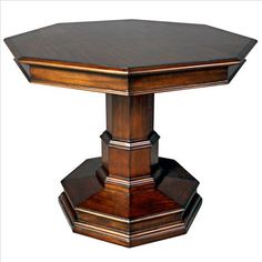 an octagonal wooden table with two pedestals