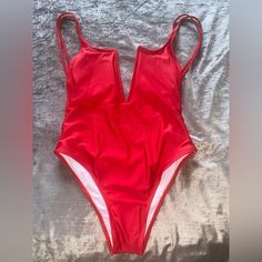 Cherry Red One Piece Swimsuit Trendy Red Bodysuit For Beach, Casual Red Bodysuit For Vacation, Spring Beach Red Bodysuit, Red Casual Bodysuit For Beach Season, Trendy Red Sleeveless Swimwear, Red One Pieces For Spring Vacation, Red Summer Vacation Bodysuit, Red Bodysuit For Beach Season Parties, Red Summer Party Bodysuit