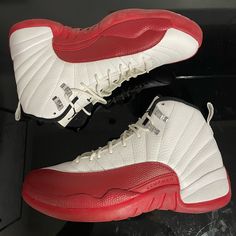 This Is A Classic Sneaker That Many Collectors Have Been Searching For. The Jordan 12 Retro Cherry 2009 Boasts A White Colorway With Red Accents, Which Are A Nod To The Original Design. The Shoe Features A Leather Upper With A Rubber Sole, Providing A Durable And Comfortable Fit. This Sneaker Is Perfect For Any Athletic Activity And Is A Must-Have For Any Sneakerhead's Collection. It Comes In A Size 9 And Is Ready To Be Added To Your Footwear Rotation. Size 9. New With Defects, Flaws Are Shown W Classic Lace-up Basketball Shoes With Red Sole, Classic Red Lace-up Jordan Shoes, Nike Air Jordan Low, Retro Cherry, Black Jordans, Jordan Retro 1, Jordan Red, Nike Air Jordan Retro, Jordan 12 Retro