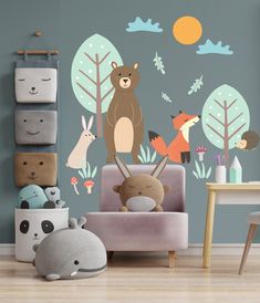 there are many animals in the forest wall decals on this child's room