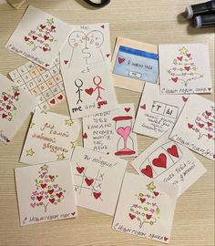 many cards have hearts on them and are placed next to a pair of black scissors