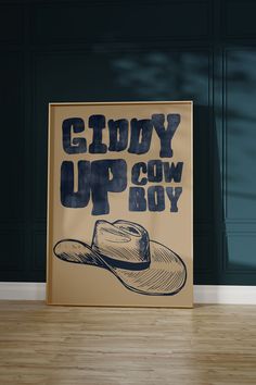 a poster with the words glory up cow boy on it in front of a wooden floor