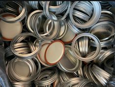 there are many tins that have been stacked on top of each other in the bin