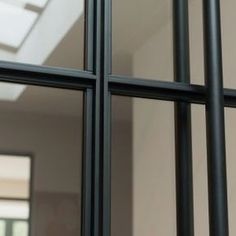 an open window with bars on each side and a skylight in the back ground