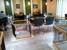 a room filled with lots of tables and chairs next to each other on top of hard wood flooring