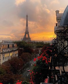 the eiffel tower towering over paris at sunset