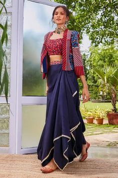 Blue cape with floral print and patchwork embroidery. Paired with bustier and drape skirt.
Components:3
Pattern:Printed
Type of Work:Floral
Neckline:Cape: Open, Bustier: Round
Sleeve Type:Long sleeves
Fabric:Silk
Color:Blue
Other Details:
Note: Neckpiece worn by the model is not for sale
Occasion:Sangeet - Aza Fashions Garba Jacket For Women, Blue Green Dress Outfit, Jacket With Skirt Outfit, Draped Skirt Outfit, Long Skirt Outfits Indian, Draping Dress, Function Dresses, Patchwork Embroidery, Trendy Outfits Indian