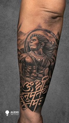 Channel strength and spirituality with this detailed Hanuman portrait tattoo featuring a powerful mantra. A perfect design for those seeking divine inspiration Hanuman Portrait, Powerful Hanuman, Aliens Tattoo, Hanuman Tattoo, Hindu Tattoo, Buddha Tattoos, Ganesha Tattoo, Explore Tattoo, Religious Tattoo