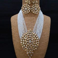 Gold Rodium Polish White and Off White color Necklace in Metal Alloy studded with Kundan, Pearl Luxury White 22k Gold Kundan Necklace, Luxury 22k Gold White Kundan Necklace, Maroon Necklace, Violet Necklace, Reception Lehenga, Engagement Reception, Color Necklace, Metal Necklace, White Necklace