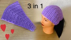 a crocheted hat is next to a mannequin's head with hearts on it