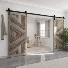 an open sliding door in a living room next to a potted plant on the floor