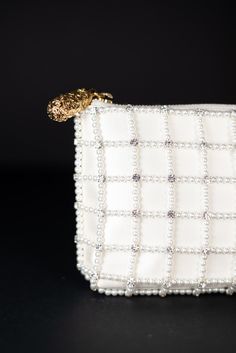 Introducing Hayden Clutch Pearl Cage - the epitome of luxurious elegance and contemporary sophistication, curated specifically for the modern woman. This exquisite clutch beautifully combines the ethereal grandeur of hand-beaded pearls and gemstones with the timeless appeal of Italian craftsmanship. Material: Duchess Satin, pearl beading. Rhinestones Petite: 8"L x 4.5"H x .75"D Handcrafted Pearl & Gemstone Grid A dream accessory, the Hayden Pearl Cage Clutch showcases a dazzling grid pattern of Sophie Bush, Pearl Beading, Custom Handbags, Heirloom Wedding, Sophisticated Bride, Duchess Satin, Couture Accessories, Bridal Clutch, Italian Craftsmanship