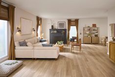 a living room filled with furniture and a fire place