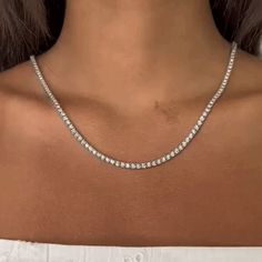 Handmade in New York of polished 14k white gold, CAPUCELLI's Tennis necklace showcases a delicate box chain embellished with dozens of shimmering white diamonds.Beautiful Diamond Tennis Necklace. A staple in your jewelry collection. Handmade in New York City of polished 14k white gold. This tennis necklace showcases a Luxury Formal Tennis Necklace With Sparkling Stones, Luxury Diamond Tennis Necklace With Single Cut Diamonds, Luxury Sterling Silver Tennis Necklace With Diamond Accents, Luxury Platinum White Tennis Necklace, Classic Crystal Tennis Necklace With Brilliant Cut, Classic Diamond Cut Crystal Tennis Necklace, Classic Crystal Diamond Necklace With Brilliant Cut, Classic Brilliant Cut Crystal Diamond Necklace, Classic Round Cut Crystal Diamond Necklace