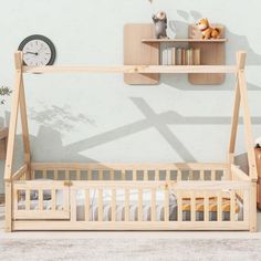 a wooden bed frame in front of a white wall with a clock on the shelf