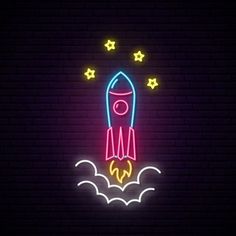 a neon sign with a rocket in the sky and stars above it on a brick wall