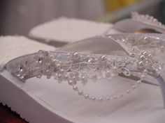 Beautiful Beach Sandals decorated with venice lace, pearls, beads, crystals, and small clear acrylic flowers. To step in comfortably, there is towel fabric back sole. Sizes: 6 to 12 SOLD OUT 8, AND 9. Whole sizes only Inventory: 6/1, 7/2, 10/1, 11/1 1 1/4'' high. 100% Vegan, no animal parts. White For IVORY = BEIGE please follow the link below: Place your order as soon as possible; 1- 2 weeks to ship. Convo me for questions or shoe size conversion to European shoe sizes. THESE SANDALS DESIGNS AR Elegant Rhinestone Flip Flops For Wedding, Elegant Wedding Flip Flops With Rhinestones, Elegant Rhinestone Wedding Flip Flops, White Wedding Sandals, White Sandals Wedding, Wedding Outdoors, Resort Wear Beach, European Shoes, Wedding Sandals