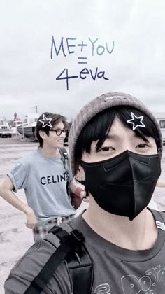 two young men wearing face masks in front of an airport