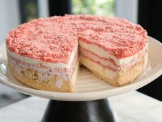 a cake on a plate with one slice cut out and ready to be served or eaten