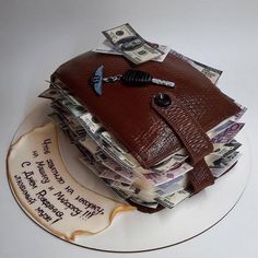 a cake made to look like a purse on top of money