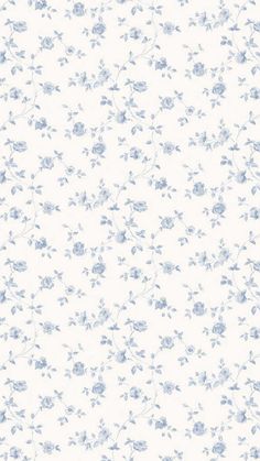 a white and blue flowered wallpaper with small flowers on the bottom half of it