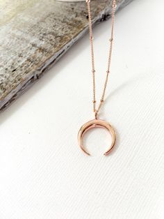 "Rose Gold Double Horn Pendant Necklace with Satellite Chain Perfect Bohemian Layering Necklace Beaded Crescent Moon Chain Necklace Great statement necklace. Great for layering. I love you to the moon in back. Perfect gift for your best friend. This necklace is very on trend, and great for everyday wear. Will not tarnish ♥ Crescent Moon Charm 24 mm x 19 mm Vermeil -18kt Rose Gold Plated over sterling silver and 925 Sterling Silver ♥ Necklace Length - 12-26\" ♥ Chain - 14kt Rose Gold Satellite Ch Rose Gold Crescent Moon Charm Necklace, Rose Gold Crescent Necklace With Moon Charm, Rose Gold Moon Phase Round Pendant Necklace, Rose Gold Moon Phase Necklace Gift, Rose Gold Moon Phase Necklace For Gift, Rose Gold Crescent Necklace Gift, Rose Gold Crescent Jewelry Gift, Rose Gold Moon Phase Necklace, Rose Gold Moon Necklace For Gift