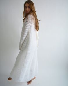 Hello, I'm the one, who won't let you down - white mohair long cardigan. I will comfort you, keep you warm and will make you smile. I'm 100% hand made and proud of that. I consist of 70% kid mohair and 30% of nylon, which makes me incredibly natural. I'm quite unique as could be worn all year long. I'm in one size and one size fits all because my measurements are : ❤️ Width -52 cm ❤️ Lengths -123 cm If you would like me in other size, you could request a custom order with your own parameters, so White Chunky Knit Sweater For Loungewear, White Long Cardigan For Winter, White Long Winter Cardigan, Long White Winter Sweater Coat, White Long Soft Knit Sweater, Long White Sweater Coat For Winter, Long White Soft Knit Sweater, White Long Winter Sweater Coat, White Long Sleeve Sweater Coat For Loungewear