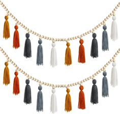 tassels and beads are hanging on a string