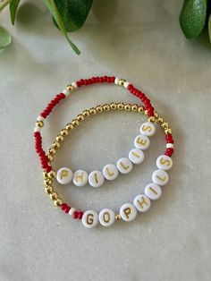 - Calling all Phillies fans! Personalize your custom Philadelphia Phillies bracelet for game day. Choose from classic red seed bead with 18k gold accents, full gold beaded beaded with red accents or get a set. Gold filled beads are much more tarnish resistant and long lasting, opposed the the more commonly seen gold plated. These bracelets layer well with others so add this to your stack for your next tailgate! Beaded on high quality stretch cord and secured. - Listing is for (1) bracelet or set Personalized Red Beaded Bracelets With Letter Beads, Personalized Red Name Bracelet With Letter Beads, Personalized Red Letter Beads Bracelet, Customizable Red Name Bracelet For Gift, Red Beaded Bracelets With Letter Beads For Game Day, Red Name Bracelet With Letter Beads For Gift, Customized Red Beaded Bracelets With Round Beads, Personalized Red Name Bracelet With Round Beads, Adjustable Red Beaded Bracelets For Personalized Gift