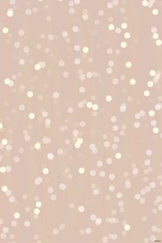 a beige background with small white dots on the top and bottom half of the image