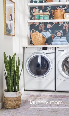 a washer and dryer sitting next to each other in front of a wall