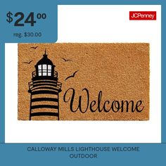 a welcome mat with a lighthouse on it