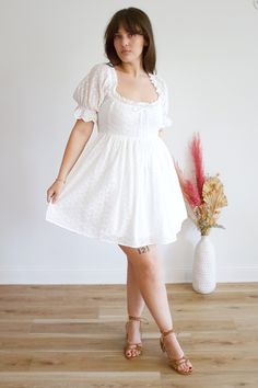 This Feona eyelet dress is the perfect summer addition to your wardrobe! Made with lightweight and breathable fabric, it features intricate eyelet details for a touch of elegance. The flowy design and comfortable fit will keep you feeling stylish and cool all day long. Chic Eyelet Midi Dress, Feminine Midi-length Eyelet Dress, Feminine Midi Length Eyelet Dress, Elegant Eyelet Dress For Summer, Elegant Summer Eyelet Dress, Casual Lace Dress For Day Out, Feminine Eyelet Dresses For Daywear, Summer Beach Eyelet Midi Dress, Casual Cotton Midi Dress With Broderie Anglaise