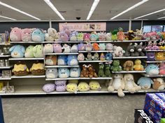 the stuffed animals are on display in the children's section of the store for sale