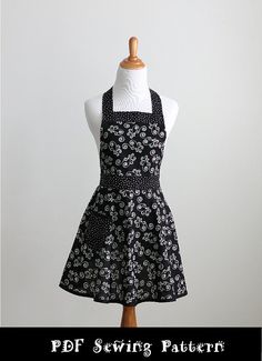 a black and white dress on a mannequin with the words sewing pattern below it