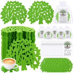 green paper cut outs and supplies for making tree coasters with coffee cup in the middle