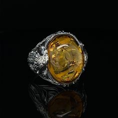 The yellow and gold colors of Amber are known to stabilize stronger and higher energies in the body and can influence them by offering balance and protection. People use Amber to get rid of negative energies, eliminate fears, acquire patience and wisdom, and even soothe bodily aches... Tim's Silver gives you the meaning and the properties of this gemstone ring. PRODUCT DETAILS Metal: 925k Sterling Silver Gemstone :  Amber ( 15mm*20mm ) Style : Celtic Gender : Male - Female Our custom unique wood Amber Signet Ring, Spiritual Oval Citrine Ring, Oval Citrine Ring With Spiritual Style, Spiritual Gold Rings With Natural Stones, Spiritual Yellow Oval Jewelry, Gold Rings With Natural Stones For Healing, Spiritual Yellow Gemstone Rings, Handmade Amber Ring With Spiritual Style, Spiritual Amber Citrine Rings