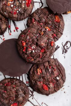 chocolate cookies with red sprinkles and drizzled on top