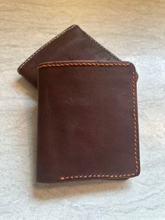 This beautifully handcrafted leather wallet combines timeless style with practical functionality. Made from high-quality, durable leather, this wallet features: A rich, brown color that ages beautifully with use. Fine, contrasting stitching that adds a touch of elegance and ensures durability. Multiple card slots to keep your essentials organized and easily accessible. A compact and minimalist design that fits comfortably in your pocket. Vintage Brown Leather Trifold Wallet With Card Slots, Brown Trifold Wallet For Everyday Carry, Artisan Brown Wallets With Interior Card Slots, Artisan Brown Wallet With Interior Card Slots, Brown Hand-stitched Card Holder For Gift, Brown Hand-stitched Card Holder Gift, Handmade Brown Wallet For Daily Use, Handmade Brown Wallet For Everyday Carry, Artisan Brown Wallets With Coin Pocket