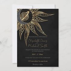 a black and gold wedding card with a sunflower on the front, which reads