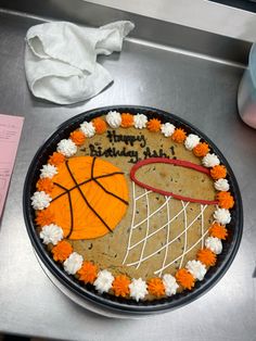 a birthday cake decorated to look like a basketball hoop