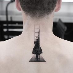 a man with a ladder tattoo on his back