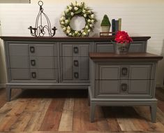 two gray dressers sitting next to each other on top of a wooden floor