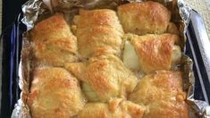 a pan filled with baked goods sitting on top of a table