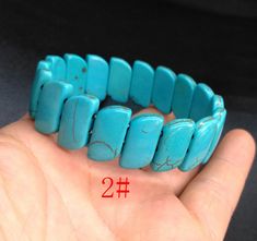 "howlite turquoise stone bracelet,bangle 1.Material: howlite turquoise , gemstone beads, stretch cord 2. size of bead, 1# approx 6mmx32mm in size. Length: 8\", width: 32mm 2# approx 10mmx18mm in size. Length: 8\", width: 18mm 3# approx 8mmx30mm in size. Length: 8\", width: 30mm 4# approx 12mmx32mm in size. Length: 8\", width: 32mm 5# approx 10mmx22mm in size. Length: 8\", width: 22mm 3.This price is one bracelet 4. notice: I try my best to make the pictures true, but there will still be color de Turquoise Stretch Bangle Bracelet As Gift, Turquoise Stretch Bangle Bracelet For Gift, Turquoise Howlite Bracelets With Natural Stones, Turquoise Howlite Gemstone Beads Bracelets, Turquoise Natural Stone Bracelets, Turquoise Hand-strung Stretch Bangle Bracelet, Turquoise Stone Bracelet, Bracelet Man, Lucky Dragon